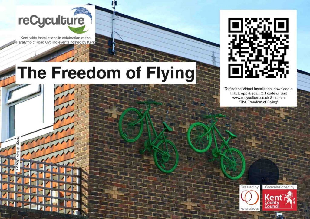 Two green bikes attached the top of a brick wall, with title, logos & QR code